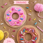 Donuts colorés en laine et carton sur une table de bricolage