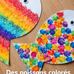 Création de poissons colorés en pompons pour un projet créatif avec des enfants.