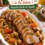 Un plat de filet de porc à la bière, prêt à être servi, avec une garniture colorée.